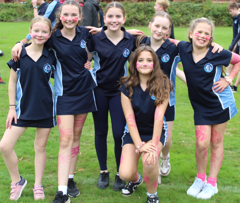 six girls in PE posing for  a photo at the race for life event