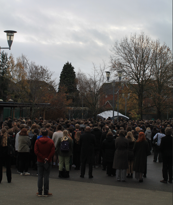 a group of the school students and staff at the service