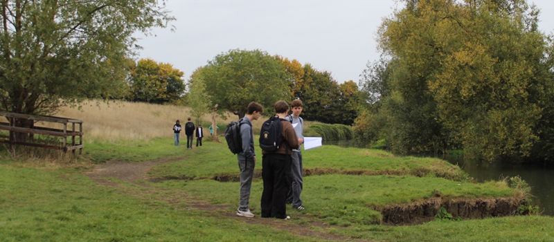 A group of people standing in a park