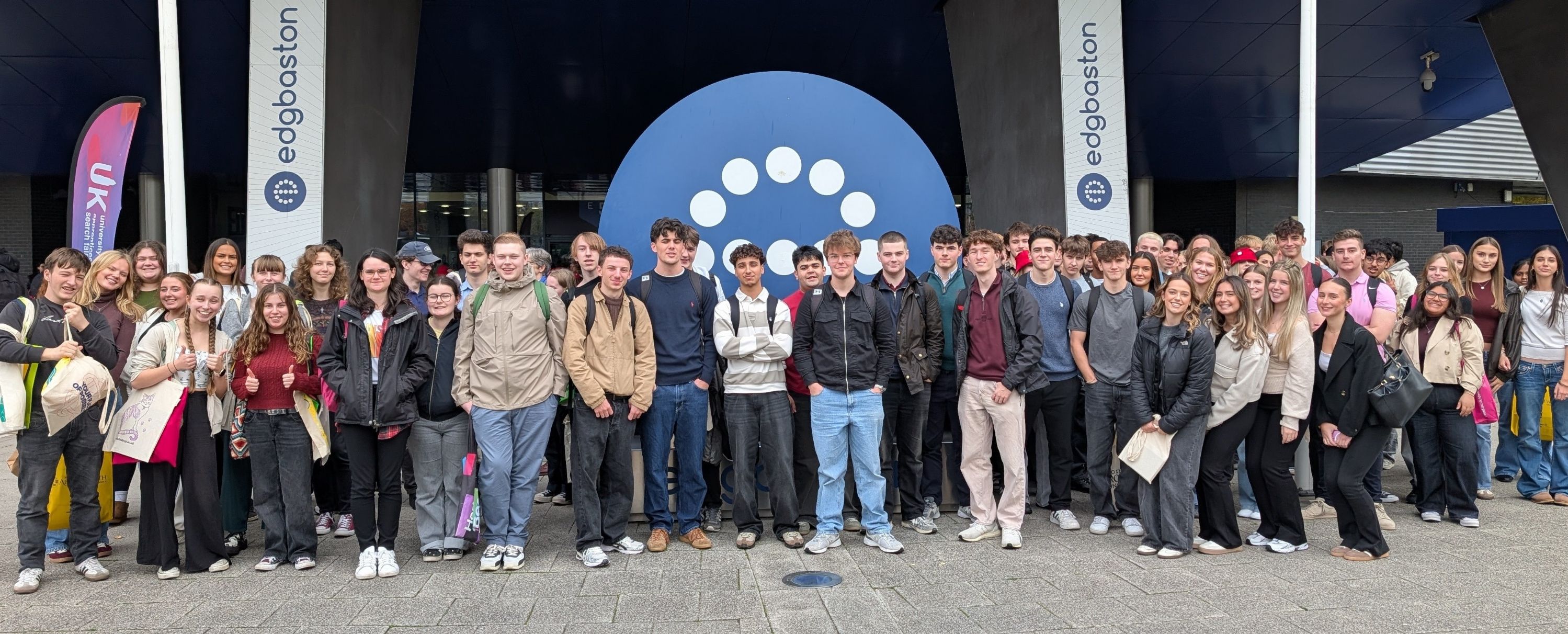 a group of year 13 student standing outside the exhibition