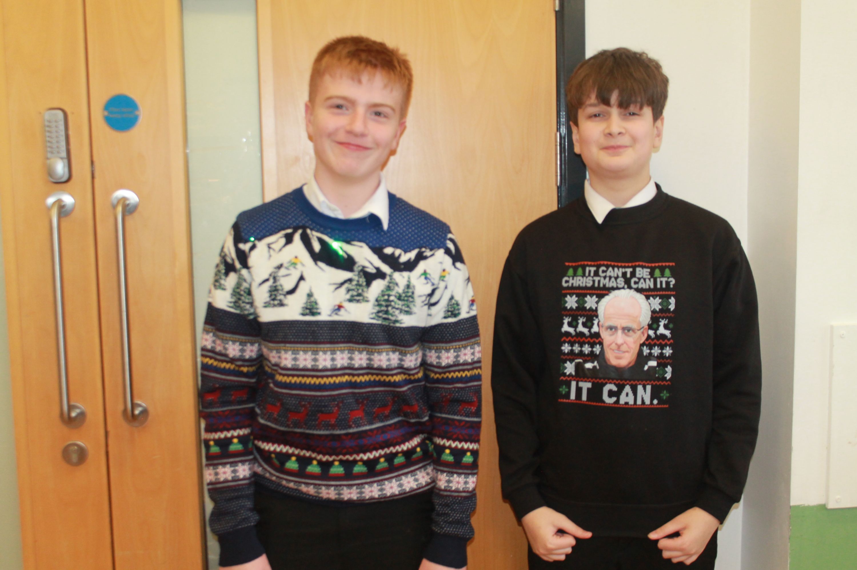 two students posing in their Christmas Jumpers