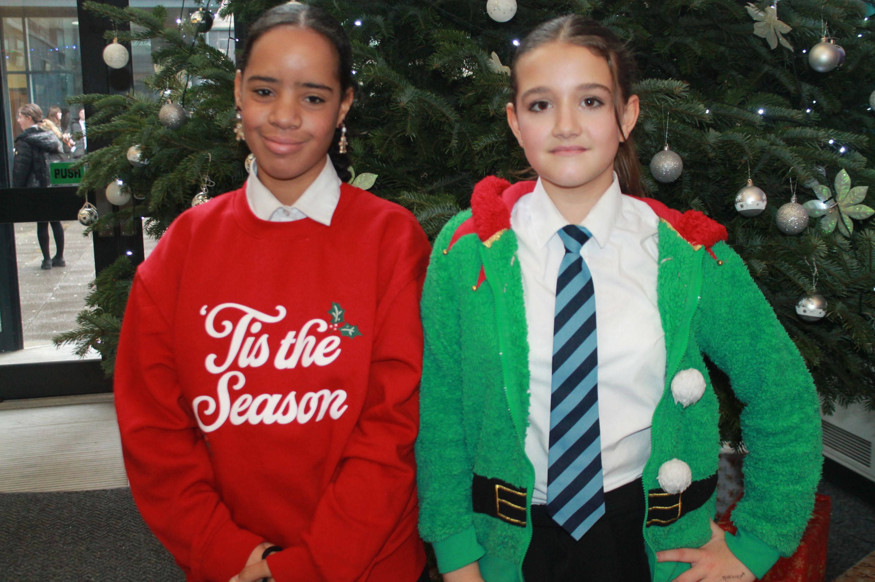 two students posing in their Christmas Jumpers