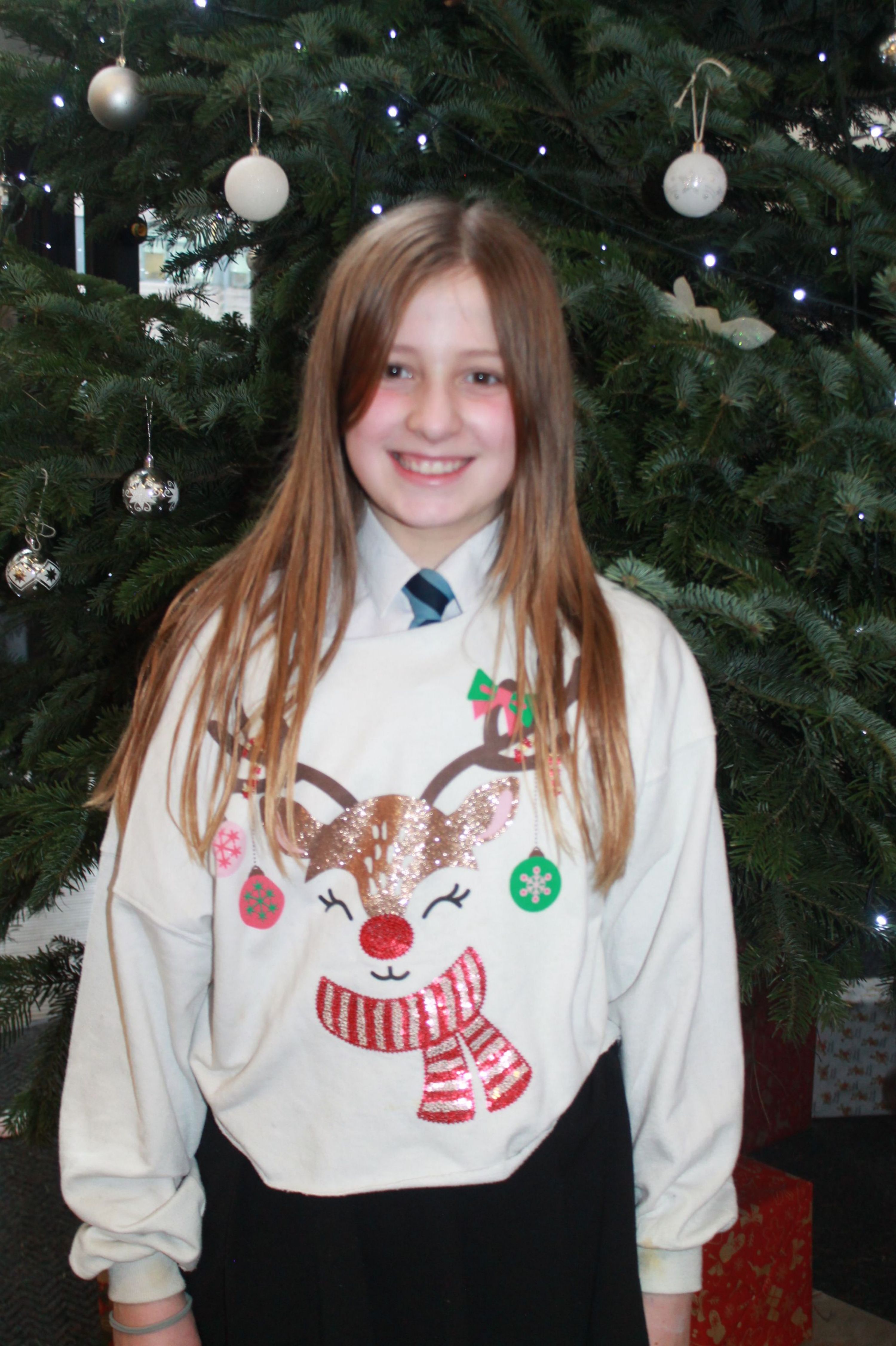 a student posing in their Christmas Jumpers