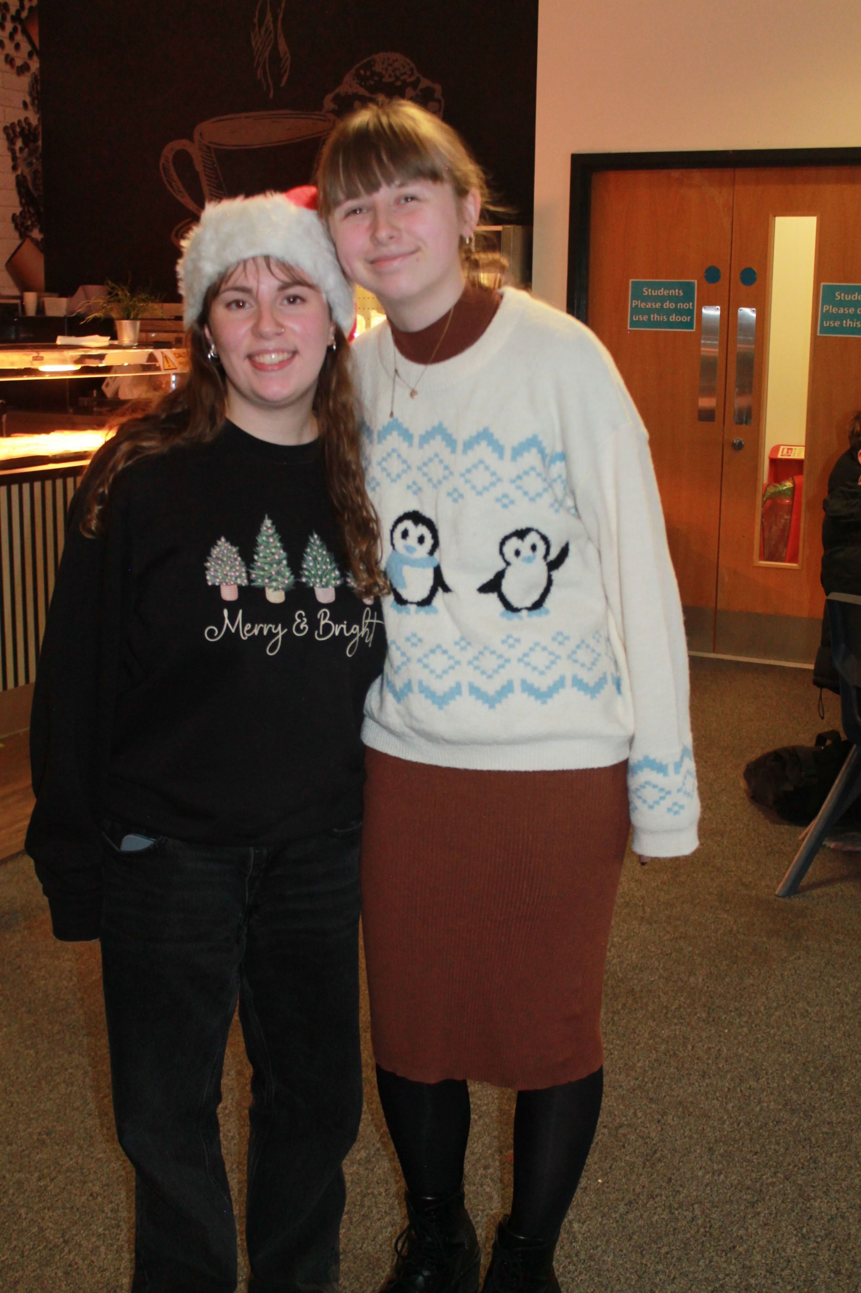 two students posing in Christmas Jumpers