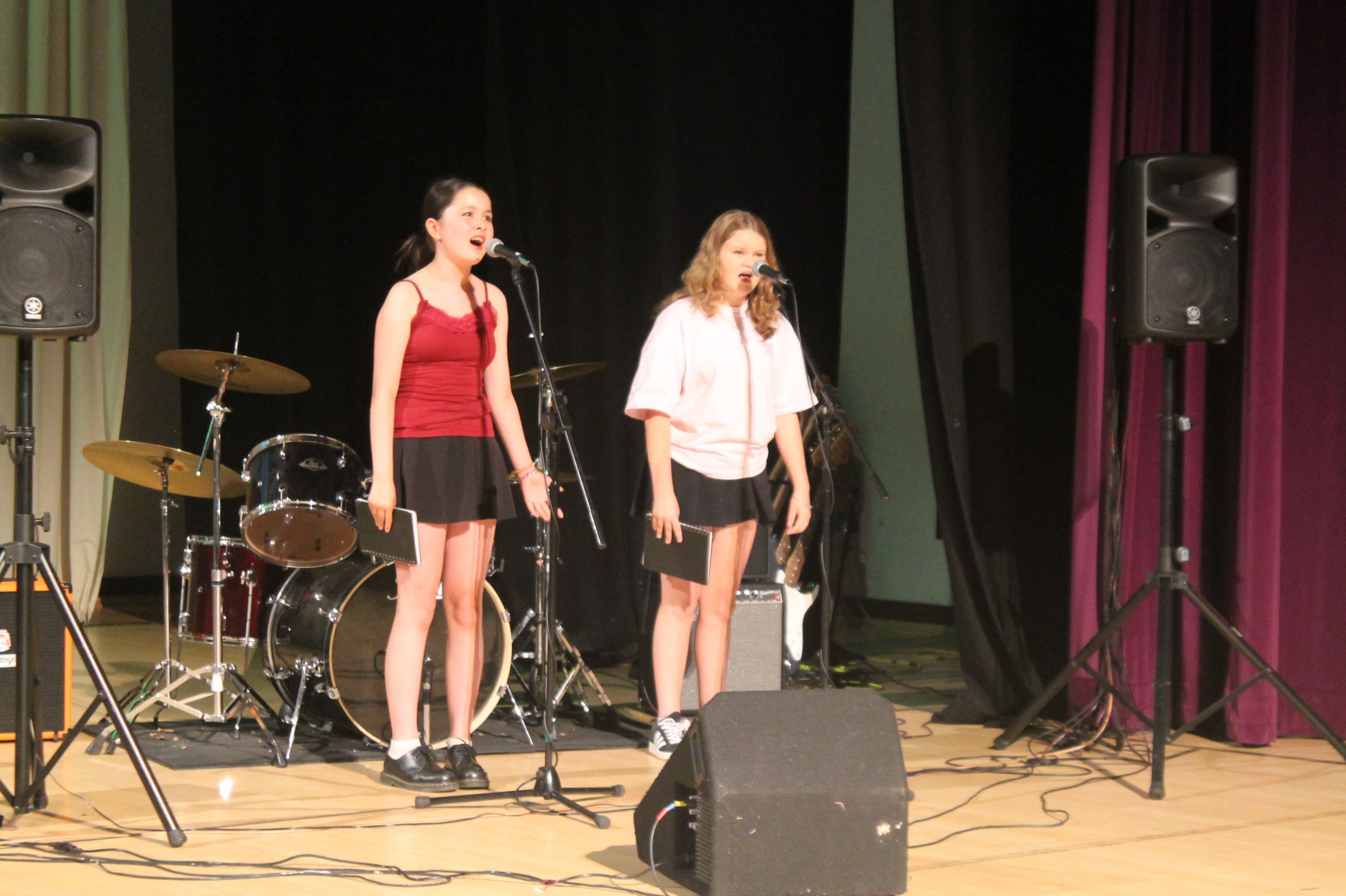 two students singing