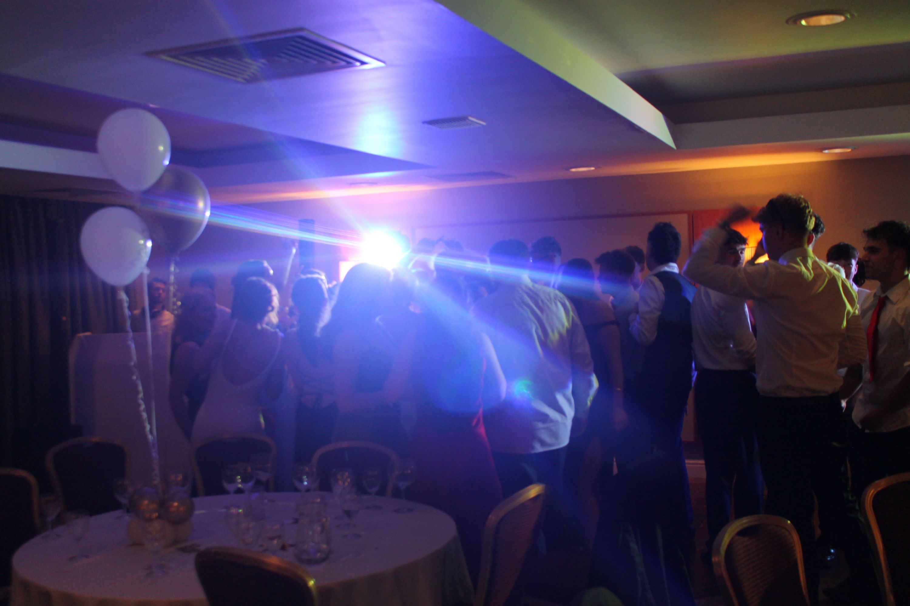a large group of students dancing at their prom