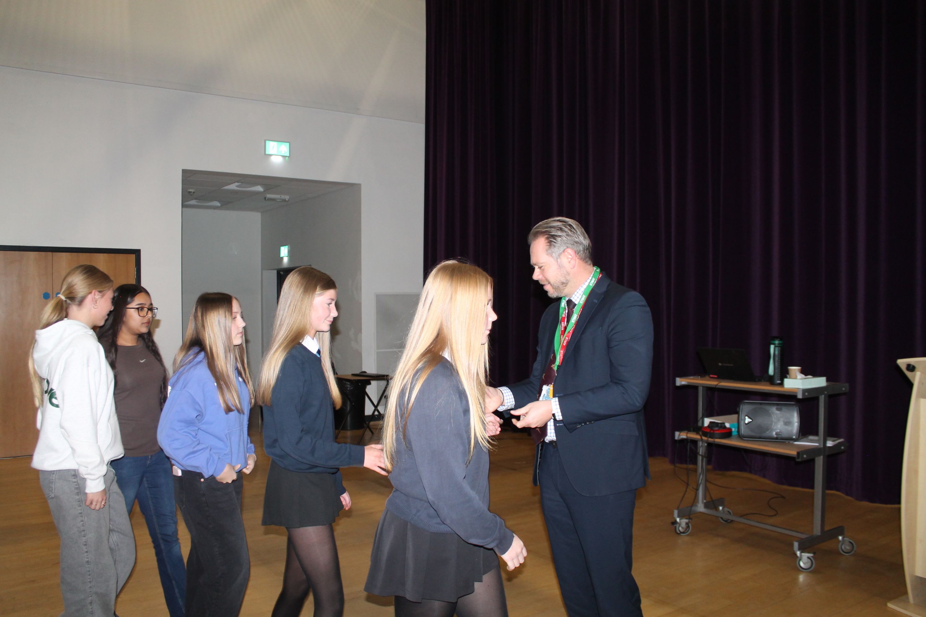 five students being presented with their DofE Badges