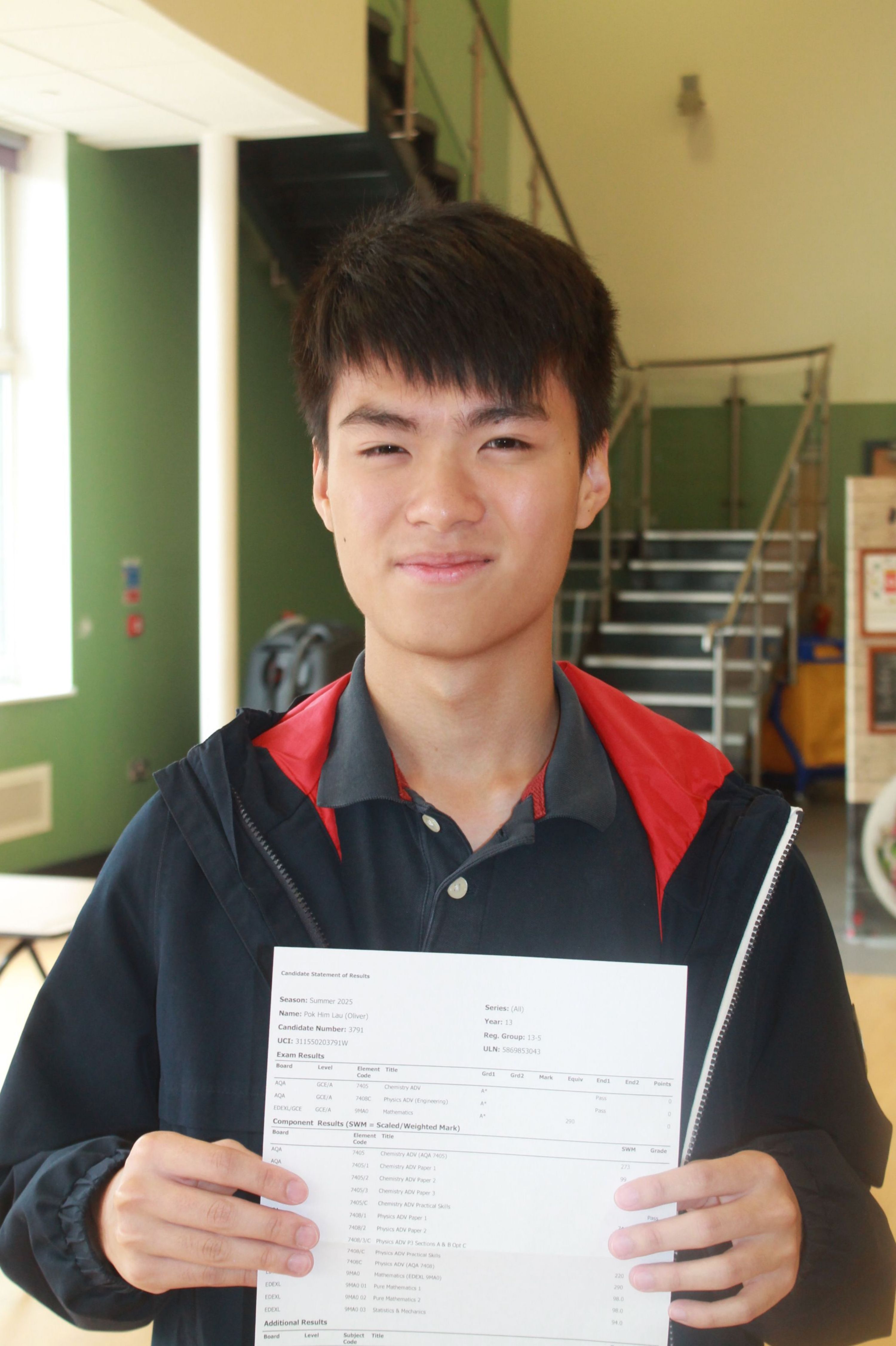 two students celebrating their A Level Results