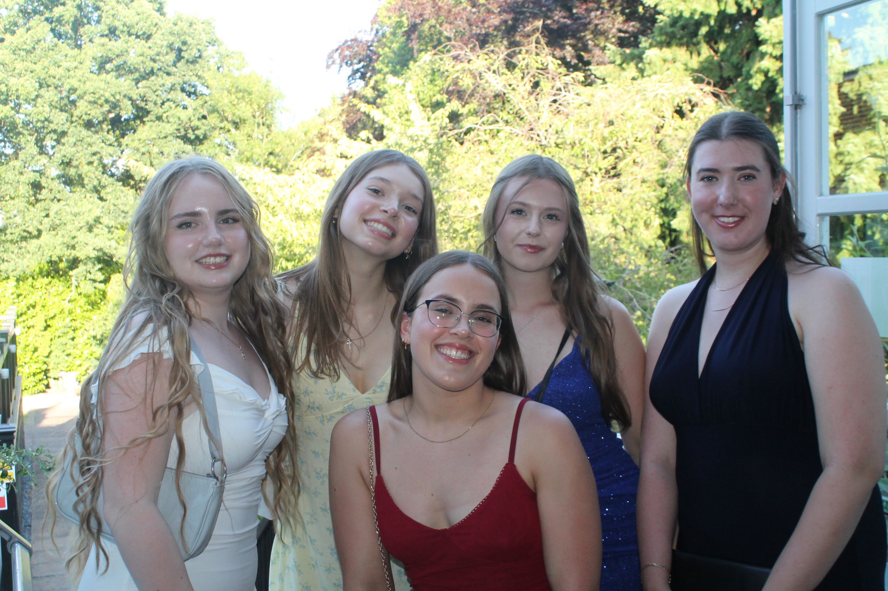 a group of 5 students at their prom