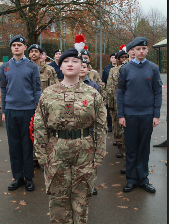 our cadet students in uniform  standing before parading 