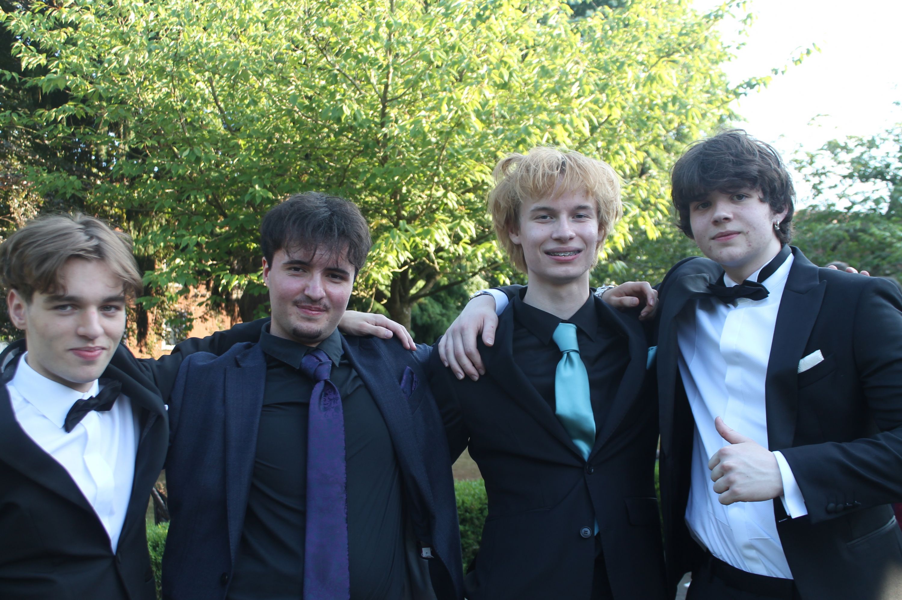 a group of 4 students at their prom
