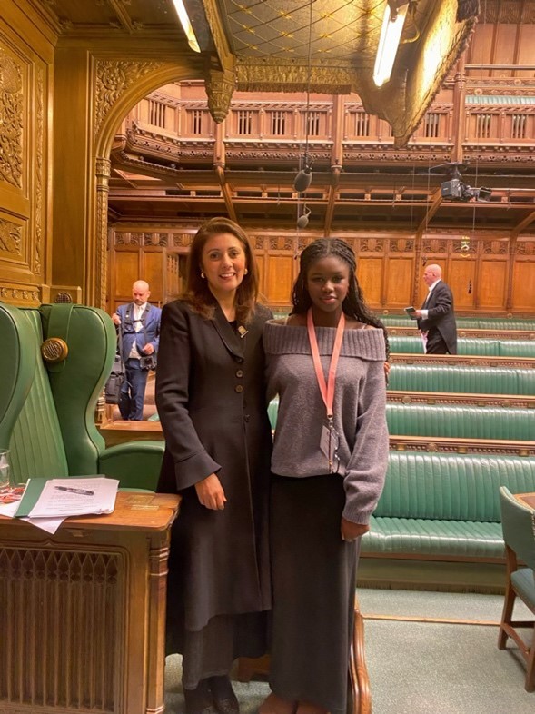 Kaddy with a lady facilitating the debate in the House of Commons