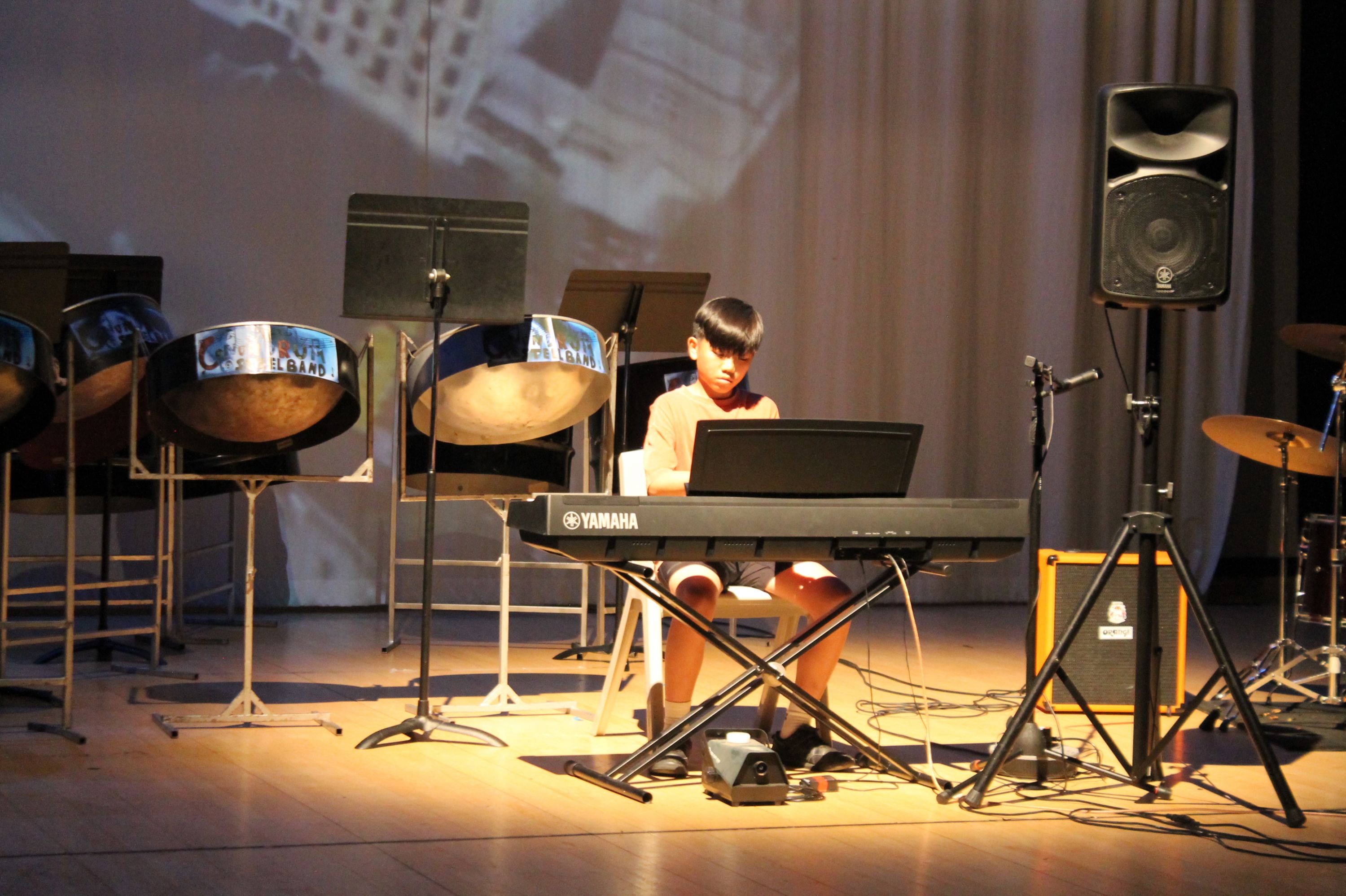 a student playing key board