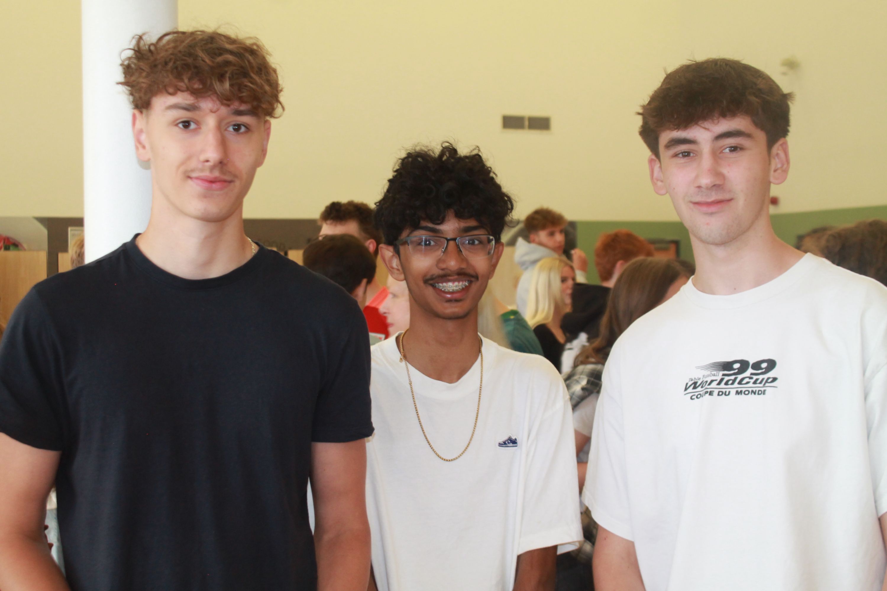 Three students after collecting their exam results  