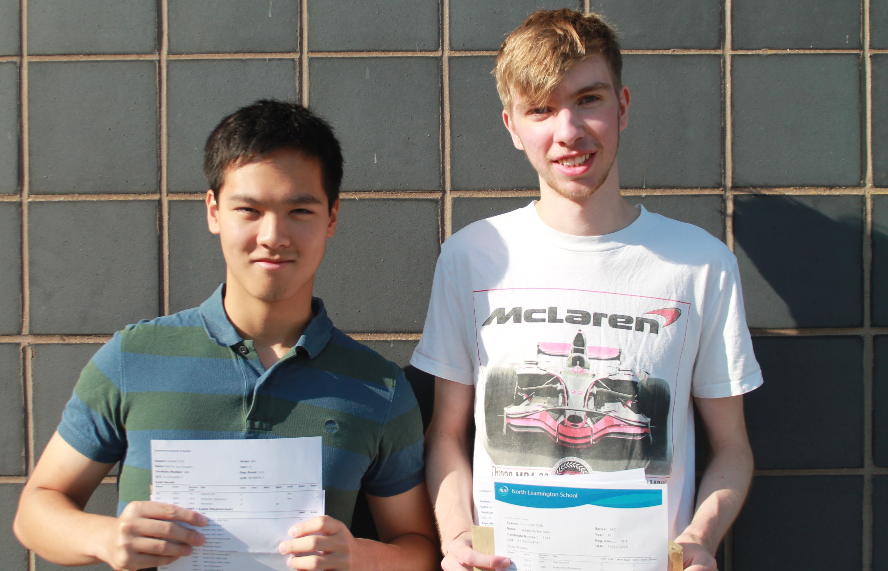 Two students with their A Level results 