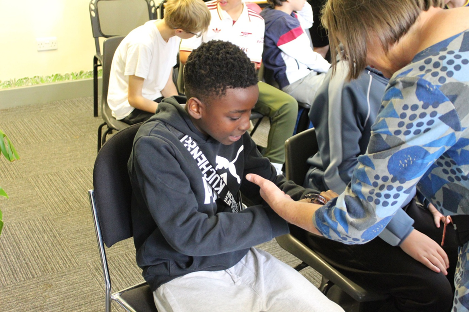 a  student holding a snake