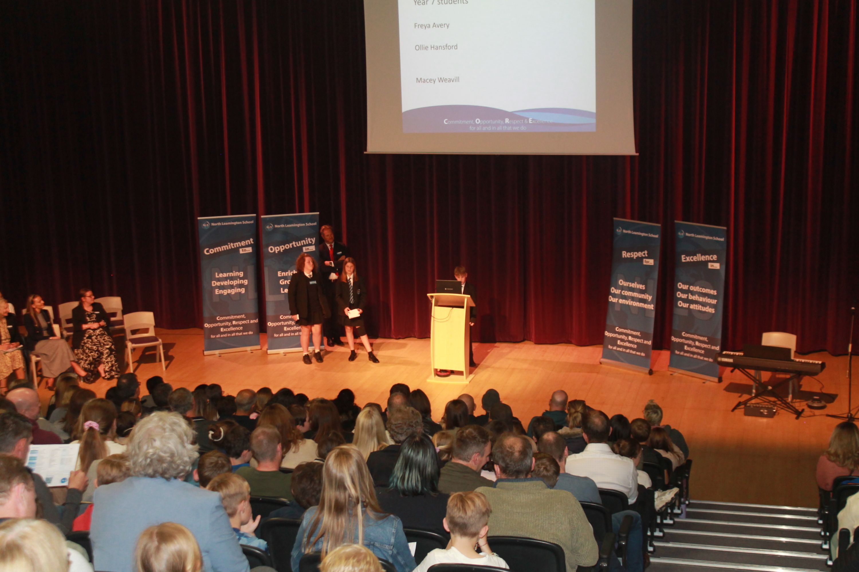 three year 7 students talking in the theatre about their experiences