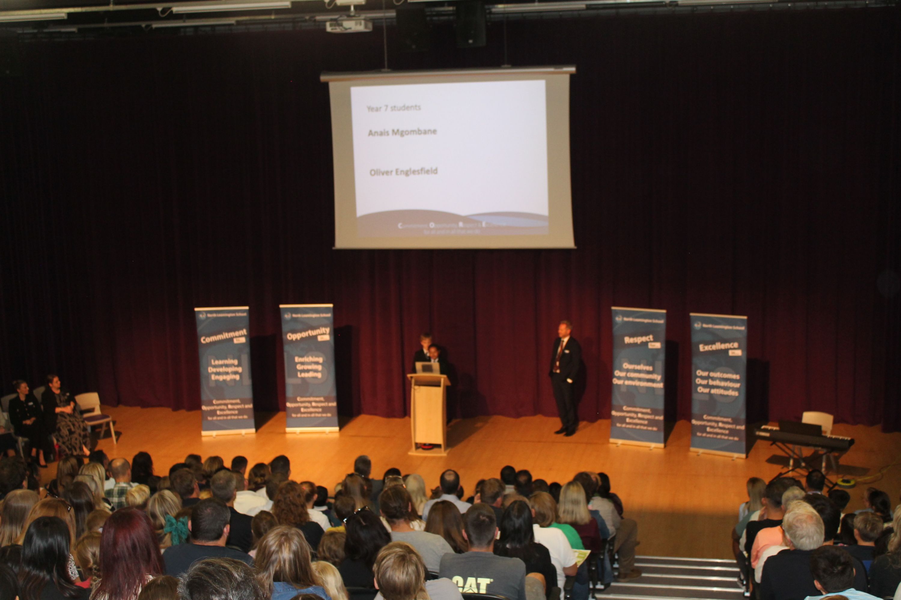 two year 7 students talking in the theatre about their experiences