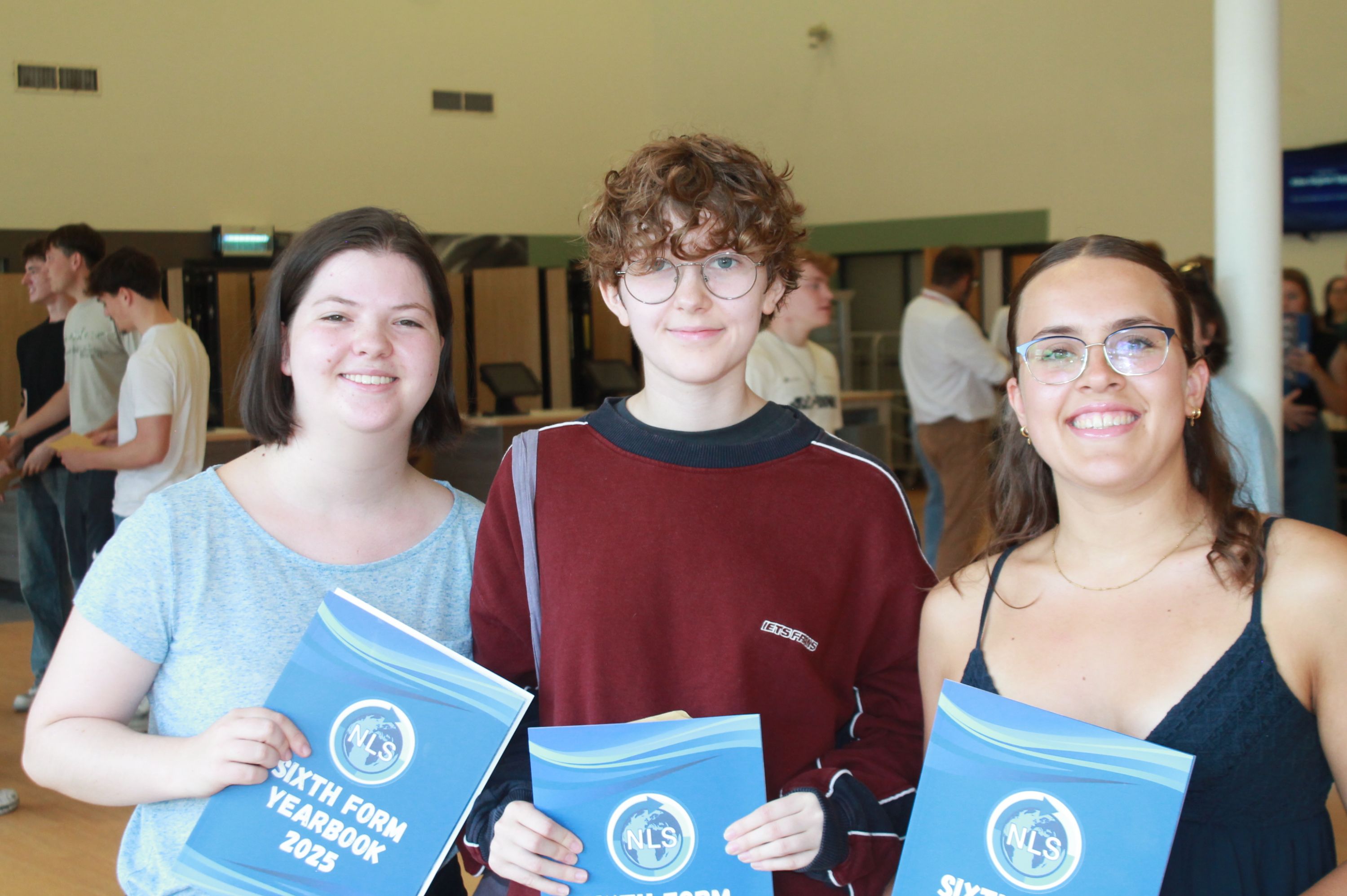 Three students celebrating their A Level Results