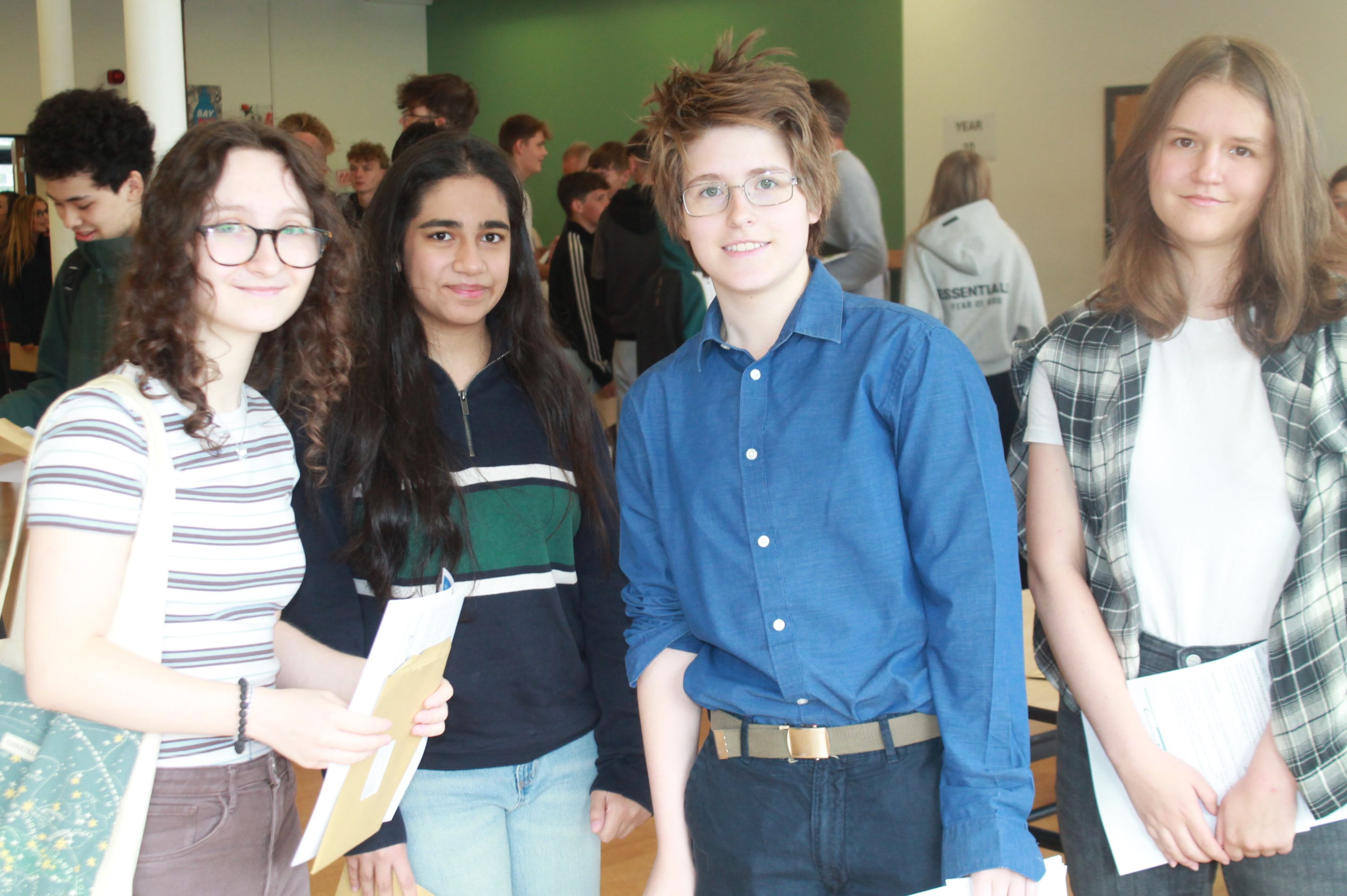 Four students after collecting their GCSE results