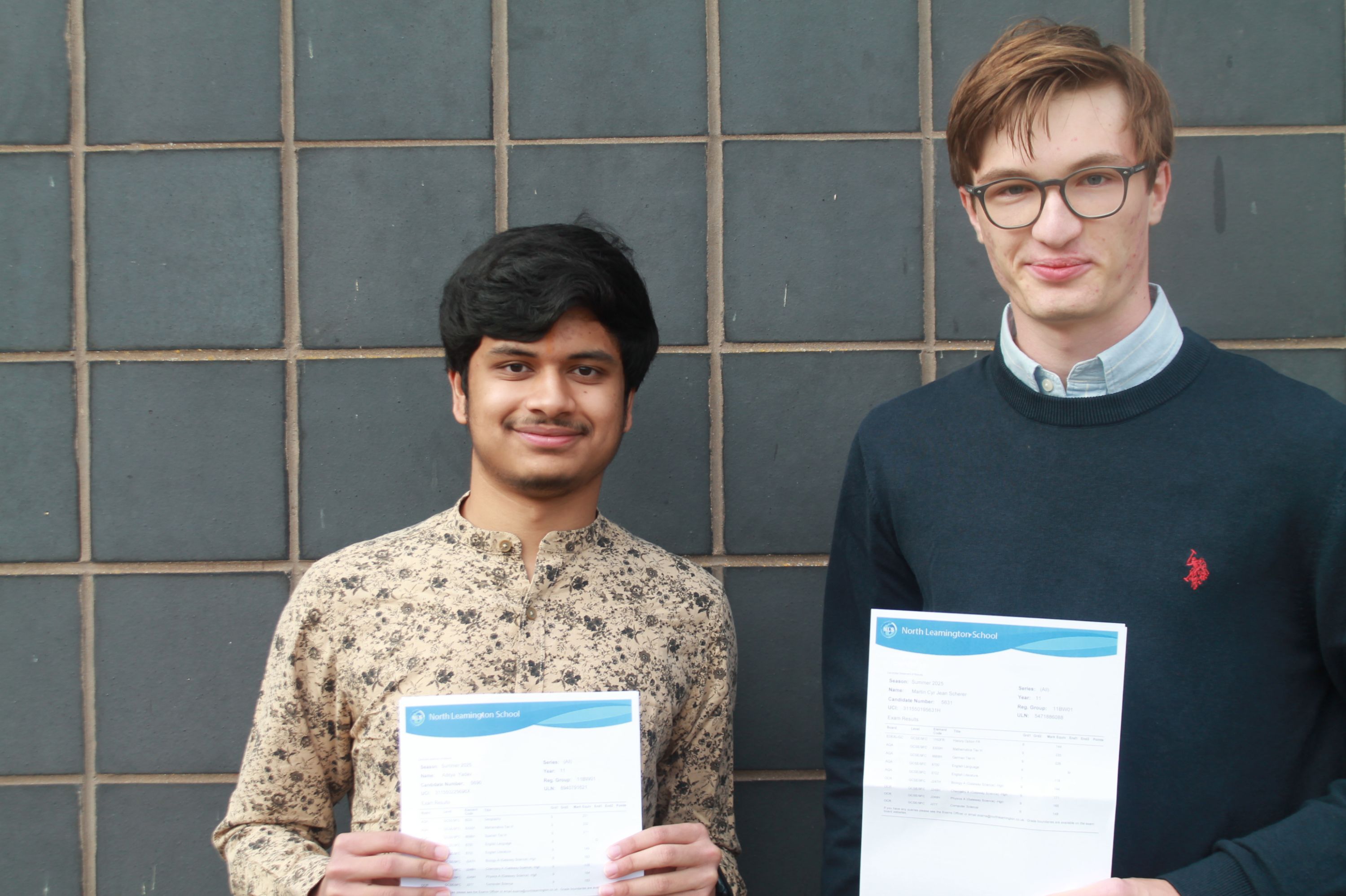 two students after collecting their GCSE results 
